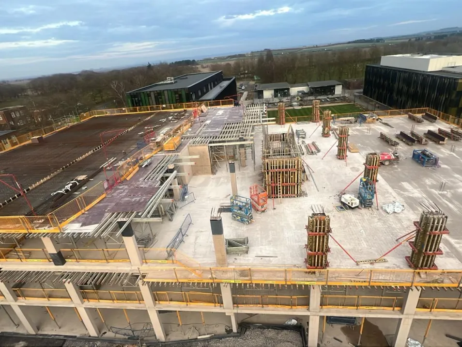 A sustainability-focused three-storey lab-enabled office building targeting BREEAM Excellent, delivered with an RC frame incorporating 70% GGBS and an embodied carbon target below 600kgCO2e/m&sup2;.