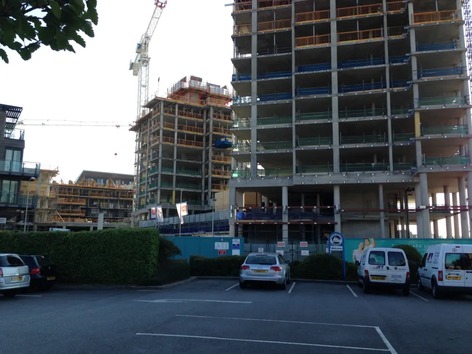 A quayside development consisting of three buildings, 26, 15 and 8 storeys respectively.